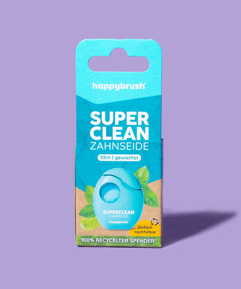 happybrush zahnseide auf lila hintergrund